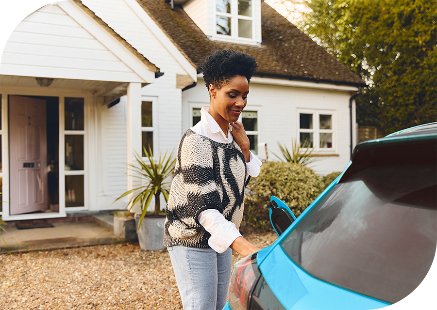 Rounded-Rectangle-Blue-car-being-charged-by-woman-at-home@0.5x.png