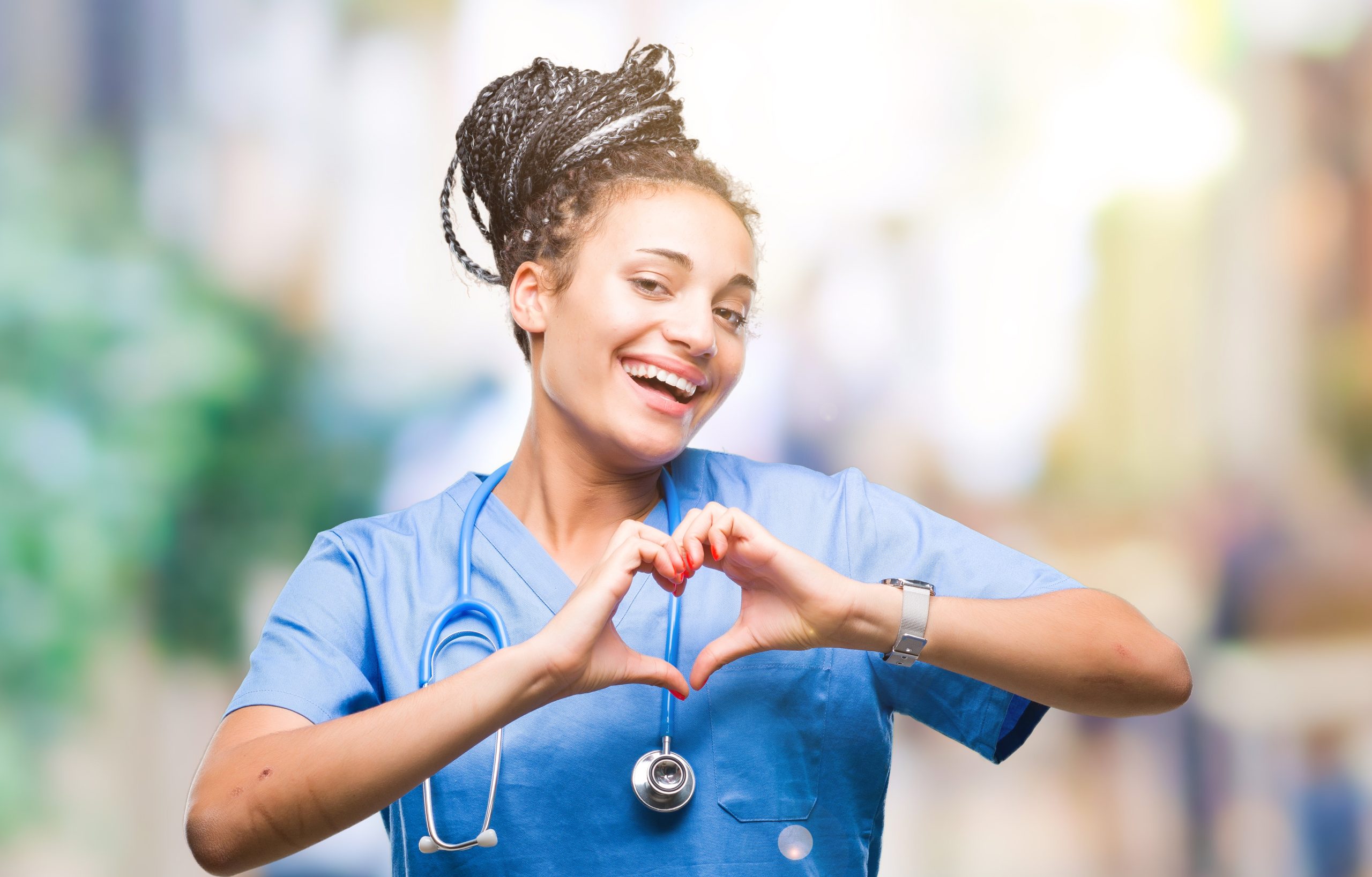 Nurse making a heart shape with her hands