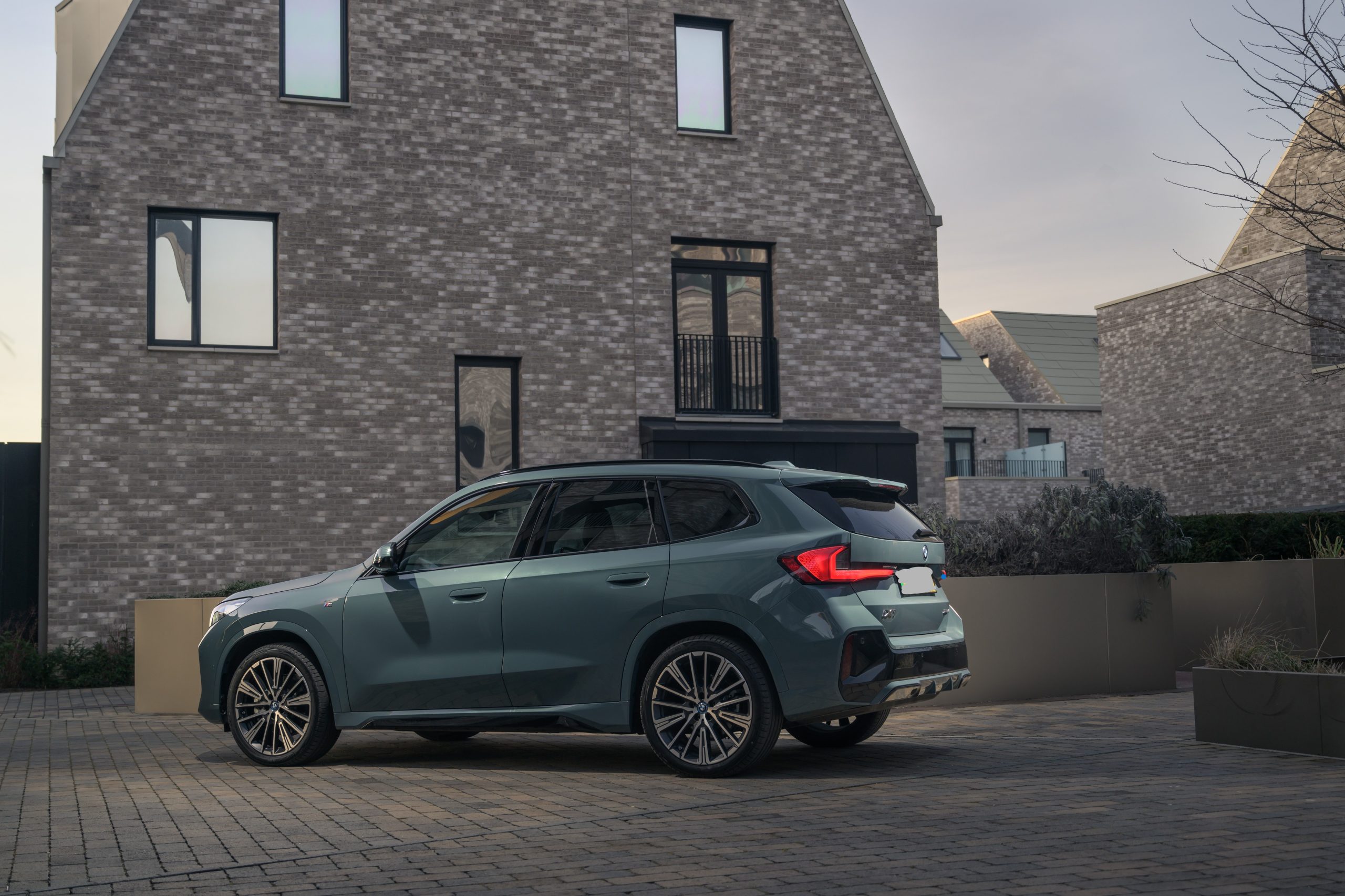 BMW iX1 exterior outside modern UK home